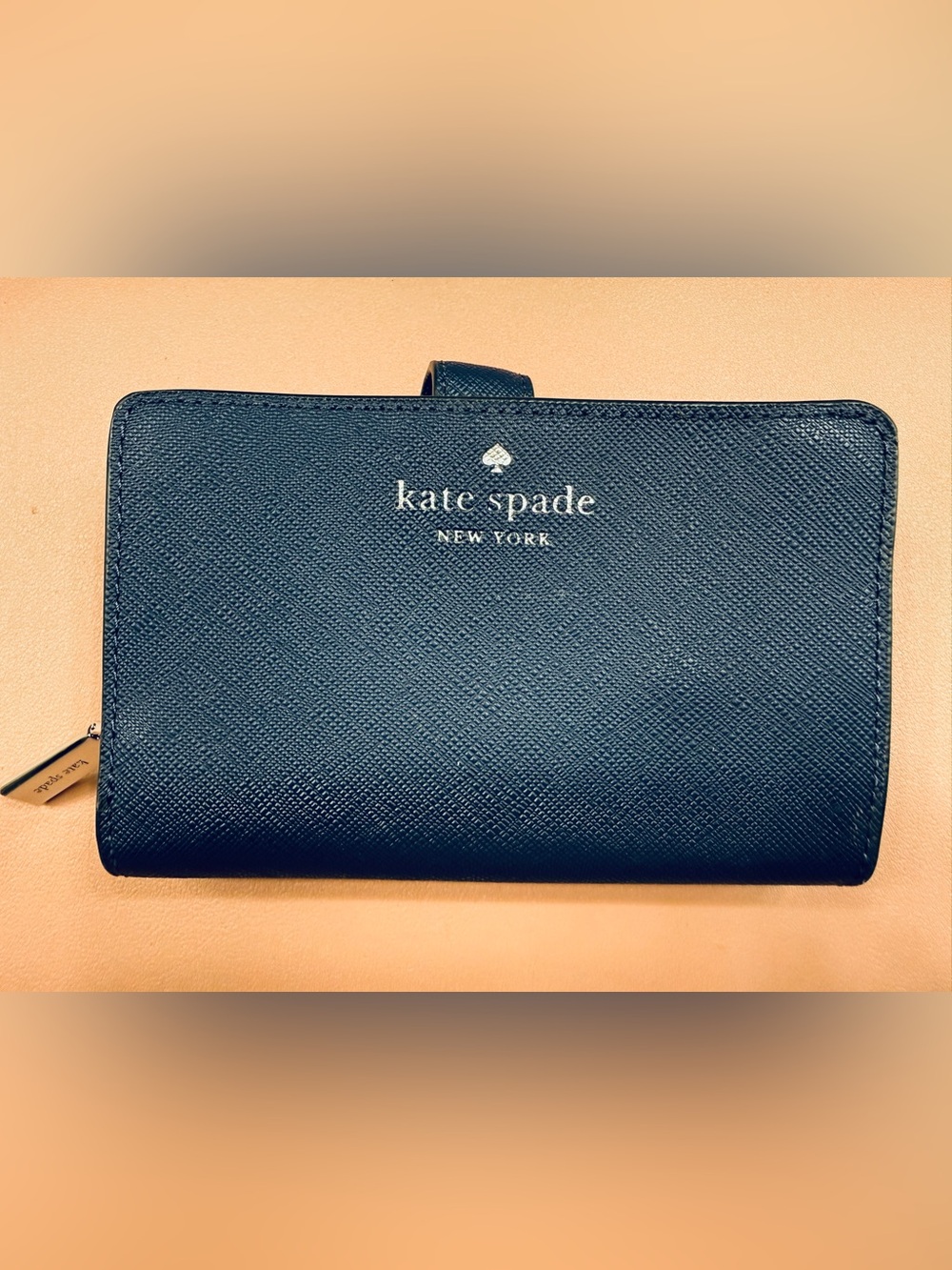 kate spade navy saffiano leather bifold wallet with gold logo